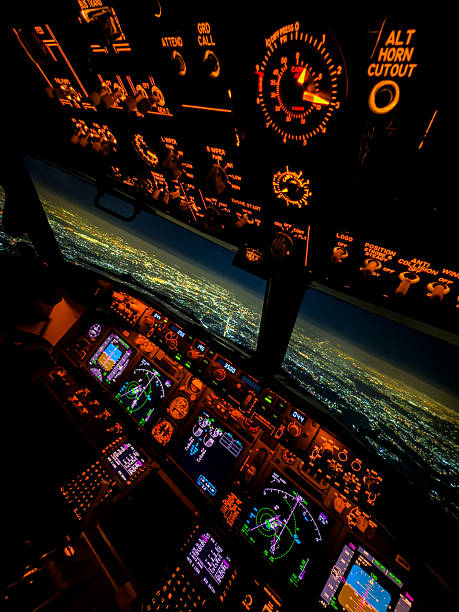 istock Dreamscape Flight – Glowing Airliner Cockpit Above a City at Night 2244610891