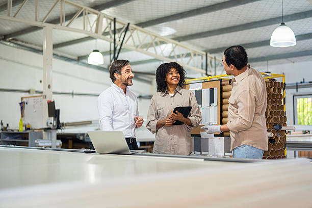 istock Latin factory owner discussing quality control issues with plant managers. 2244611772