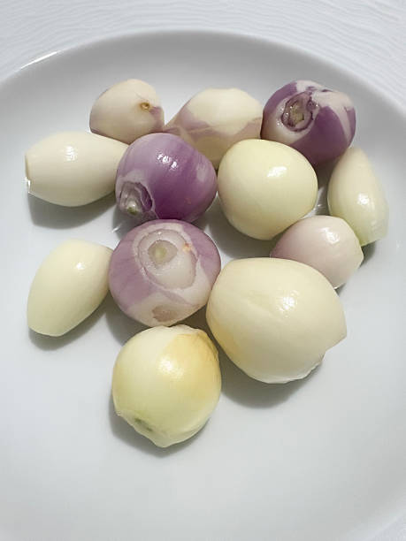 Shallots and garlics in a plate