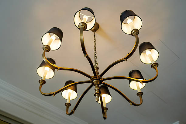 istock Modern Brass Chandelier with Warm Lighting 2244615173