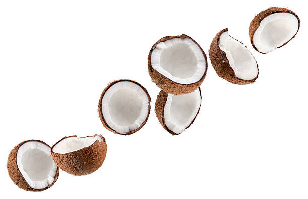 istock Beautifully retouched coconut halves fly through space, forming a chain shape. Isolated on white. 2244615294