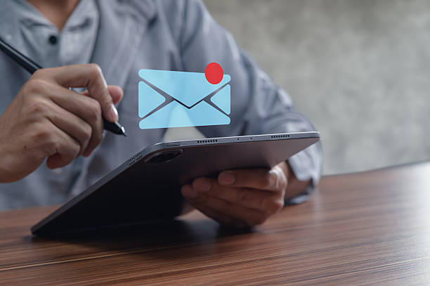 istock Person Using Tablet for Sending and Receiving Emails in Modern Workspace 2244616339