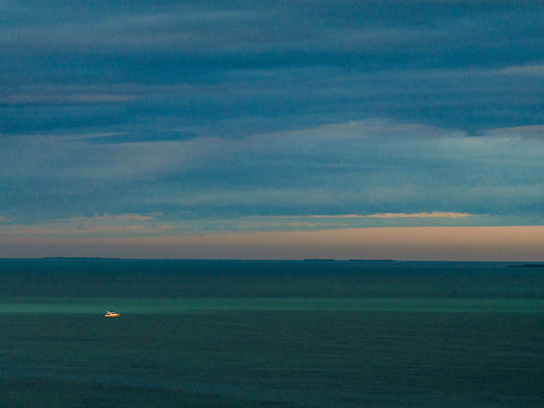 The sunrise over the Atlantic Ocean on the East Coast of Florida near US1 Overseas Highway. Tourism in the Florida Keys features water, sun, fishing and diving.