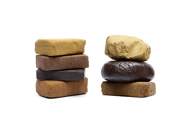 istock Blocks of hashish isolated on white background 2244617338