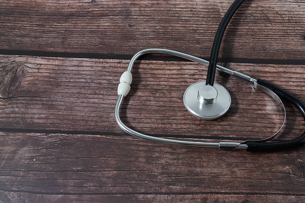 istock Medical concept with a stethoscope on a classic wood background 2244617854