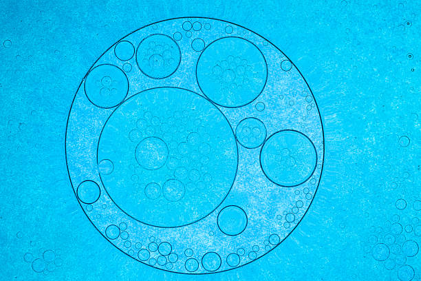 istock Macro blue bubble texture,Close up macro Aloe vera gel cosmetic texture blue background with bubbles. Lemongrass gel skincare product. antibacterial liquid with aloe vera, moisturizing. Safe and environmental friendly. 2244617965