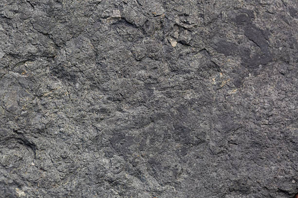 istock Close-up macro granite texture,Close-up of granite surface,Dark gray black slate background texture for wall covering,Close-up detailed photo of a light gray stone background. 2244618016