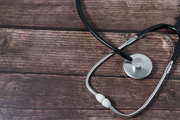 istock A stethoscope on wood classic background 2244618216