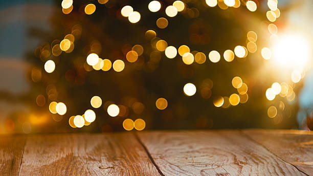 istock Bokeh Christmas Lights On Wooden Table 2244618412