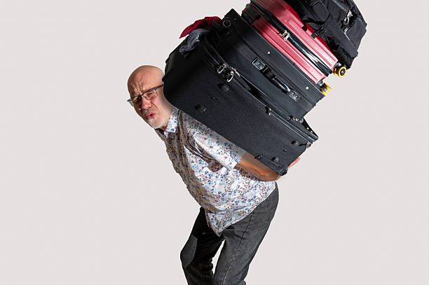 istock Mature man carrying a heavy past 2244620749