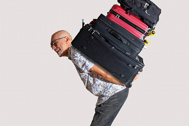 istock Mature man carrying a heavy past 2244620757