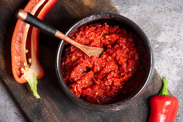 istock Rich Red Pepper Paste Served in a Bowl with Fresh Peppers 2244623220
