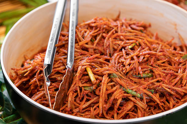 Sun-dried radish strips seasoned with spicy tangy sauce.