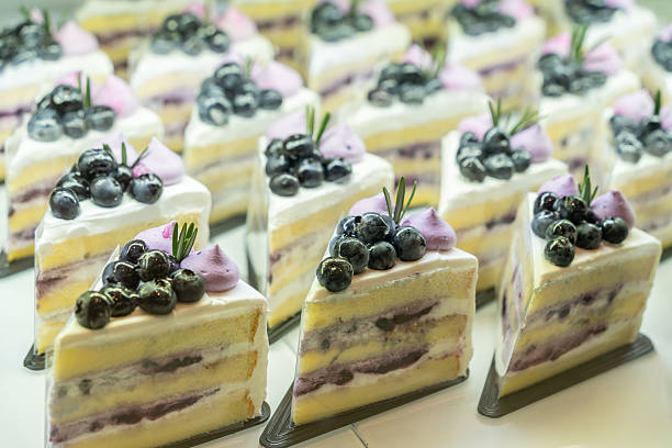 Delicious assorted blueberry yogurt slice on bakery display for sale.