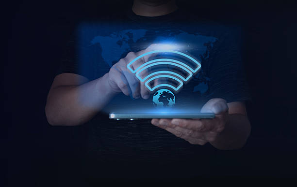 istock Digital wireless connection concept showing glowing Wi-Fi symbol above tablet. Represents global internet access, connectivity, data transmission, smart communication, and modern digital technology innovation. 2244626142