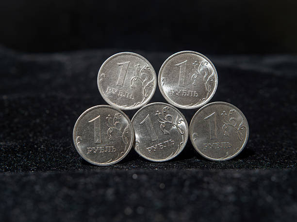 istock Stacked Russian Ruble Coins on a Dark Background 2244628858