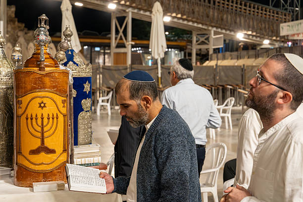 Jerusalem, Israel- October 14,2025 Torah Scrolls at the Western Wall Surrounded by Praying Jews During the Celebration of Simchat Torah