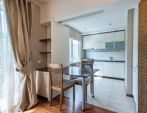 istock Modern Home Kitchen and Dining Area with Bright Natural Lighting and Elegant Decor 2244631820