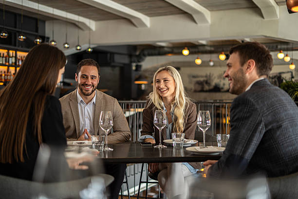 istock Business colleagues having lunch at a restaurant 2244632100