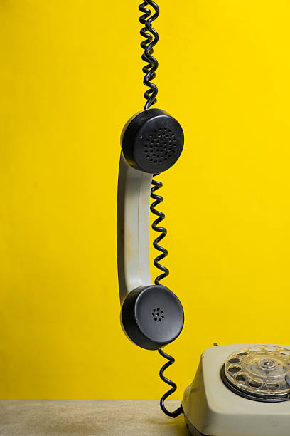 istock Retro telephone on yellow background. Closeup. 2244633789