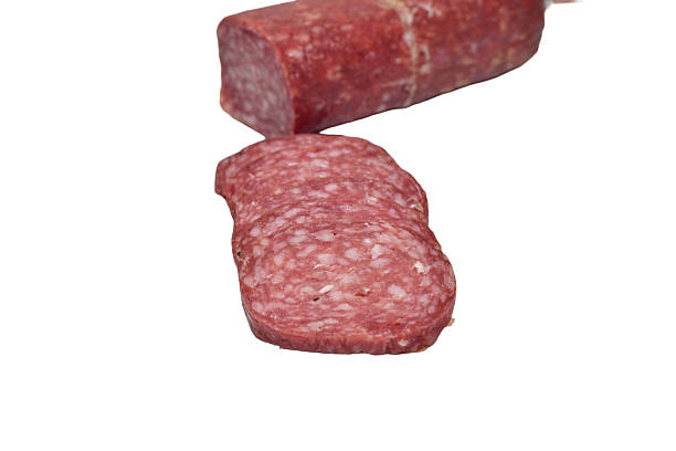 istock Dry-cured sausage is cut into thin slices. 2244634522