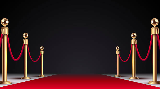istock Luxurious red carpet with golden stanchions and velvet ropes 2244634815