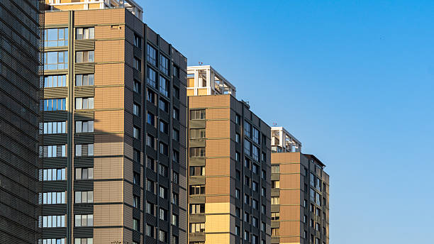 istock Modern Apartment Buildings Under Blue Sky 2244636526