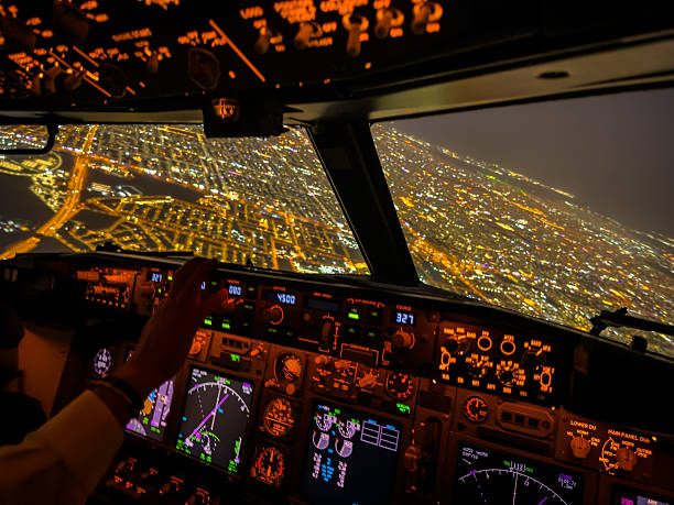 istock Dreamscape Flight – Glowing Airliner Cockpit Above a City at Night 2244638152