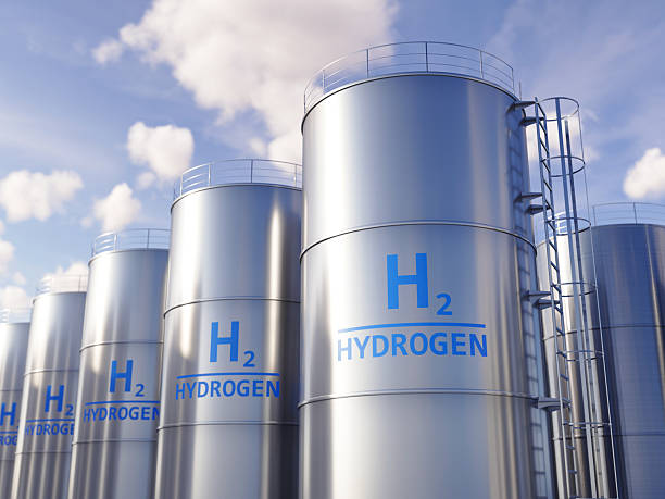 istock Modern hydrogen tanks storage for renewable energy - Hydrogen renewable energy production for solar and windturbine facility. 3d rendering 2244639537