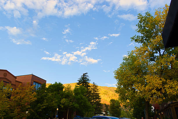 Aspen, Colorado, USA - Sept 28, 2024: Landscape, Aspen city skyline, mountains with colorful fall foliage on the background.