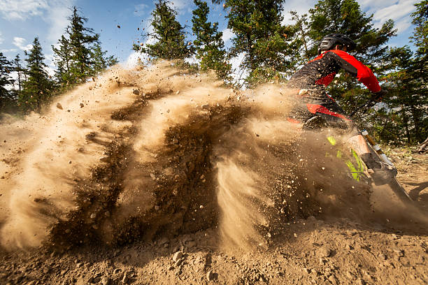 istock Male mountain biker carves turn in dust 2244639755