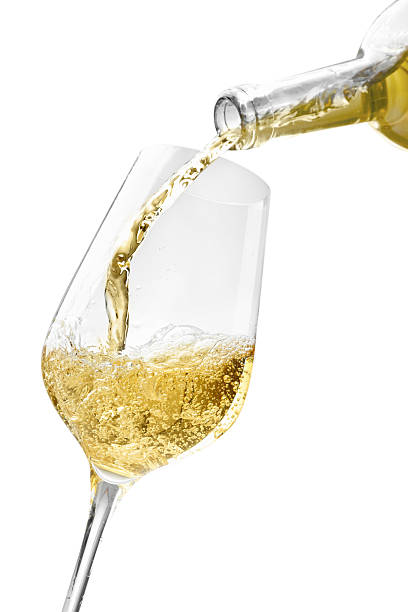 istock Pouring wine into glass isolated on white 2244639962