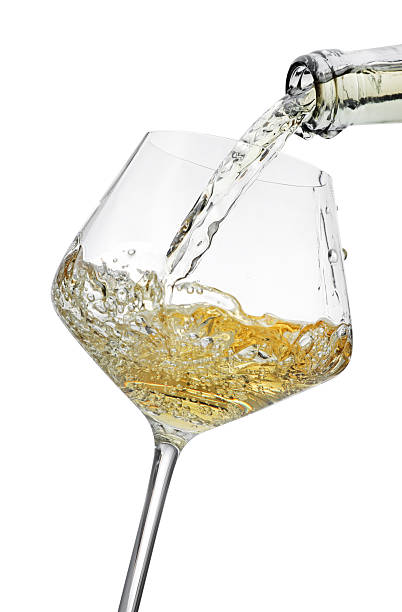 istock Pouring wine into glass isolated on white 2244640025