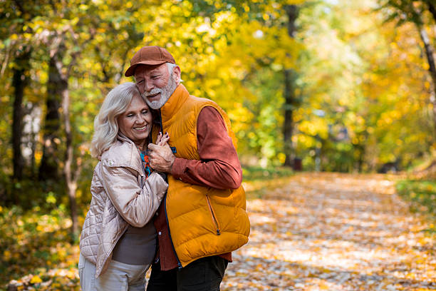 istock Senior romance in autumn park 2244640038