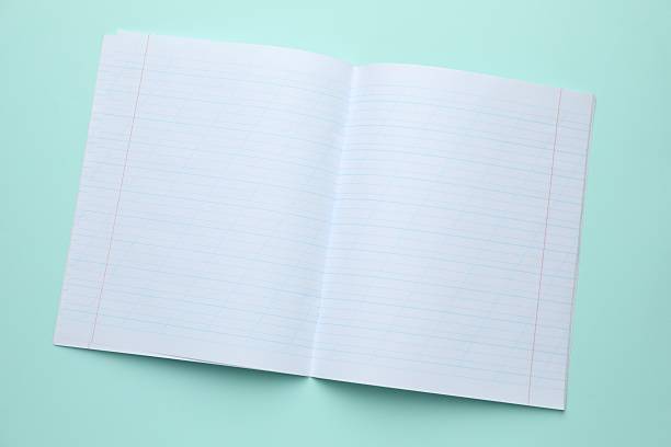 istock Open copybook on light blue background, top view. School stationery 2244642540