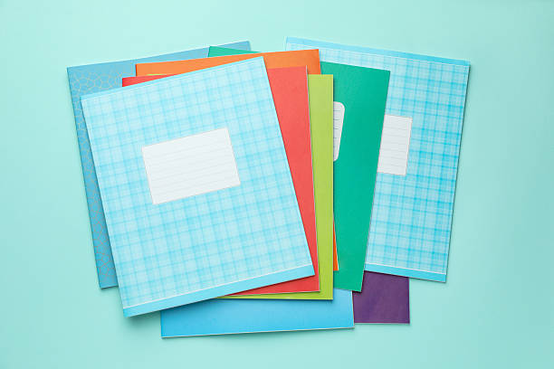 istock Colorful copybooks on light blue background, flat lay. School stationery 2244642601