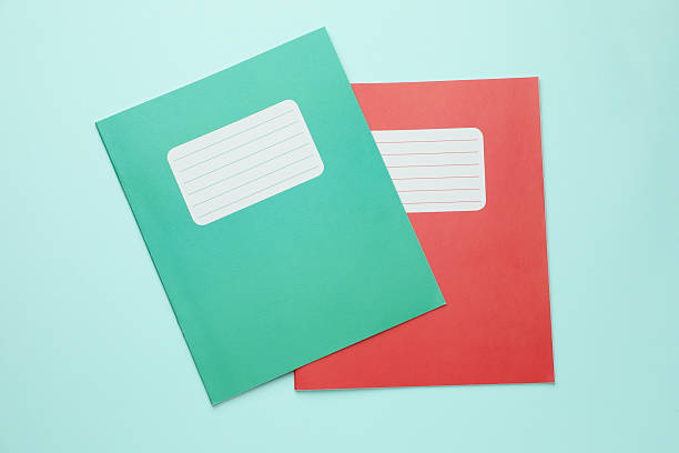 istock Colorful copybooks on light blue background, top view. School stationery 2244642733