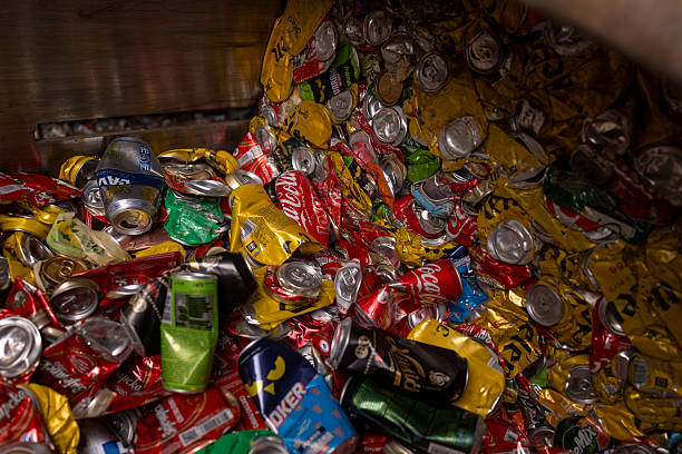 istock Crushed Aluminum Cans Packed In Large Bales Ready For Recycling Process 2244643206