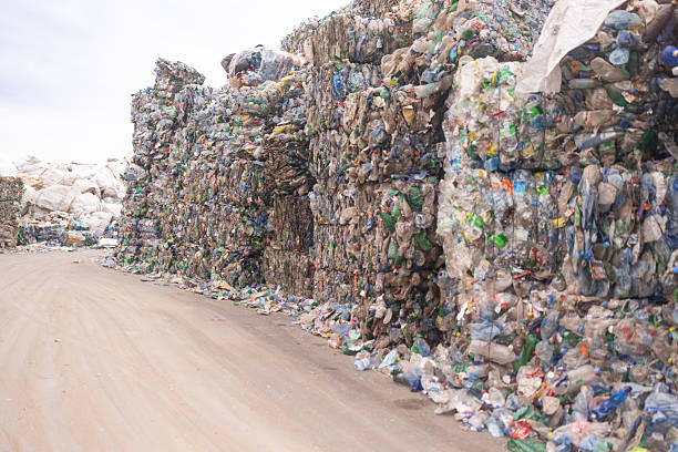 istock Large Bales Of Compressed Plastic Bottles Packed Outdoors For Recycling Process 2244643215