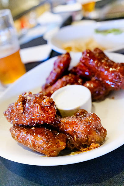 istock Barbecue chicken wings with dip and beer 2244643962