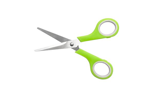 istock School scissors closed, green handle isolated on white background. School stationery 2244644610