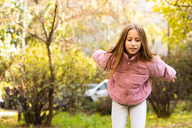 Happy girl playing in the park