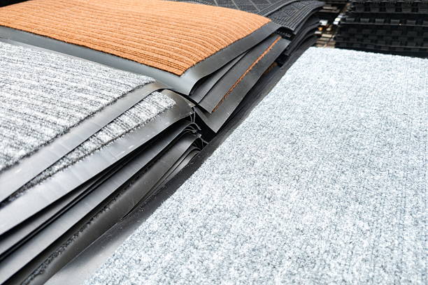 istock Different types of floor mats stacked neatly at a home improvement store showcasing various colors and textures 2244646256