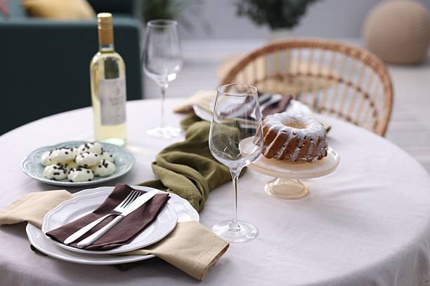 istock Festive table setting with dishware, desserts, wine and glasses indoors 2244649431