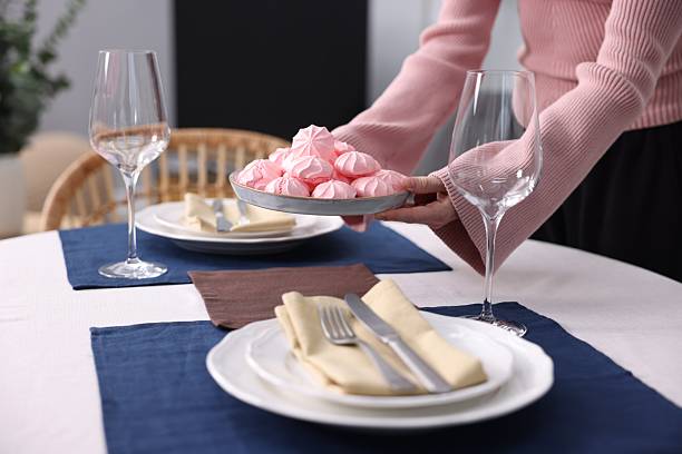 Set of empty white ceramic plate with stainless steel cloche luxury on wood table, Eating utensil set, Elegant style