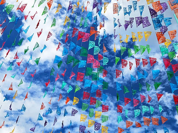 Mexican Papel Picado Flags are waving in the sky