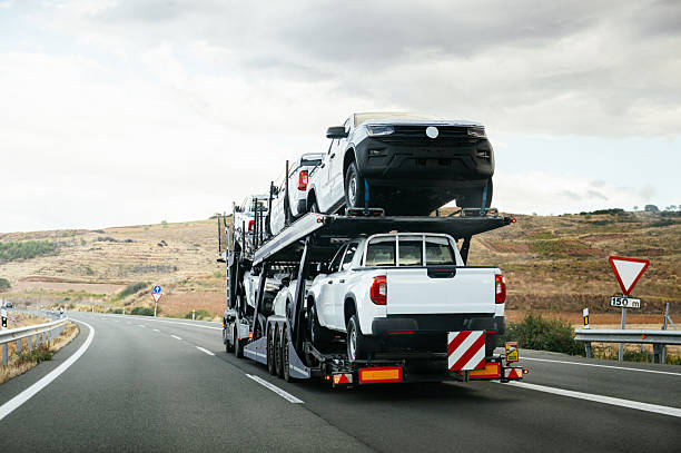 istock Truck transporting pick-up trucks 2244653593