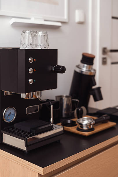 istock Modern black coffee machine making fresh espresso in stylish home kitchen 2244658115