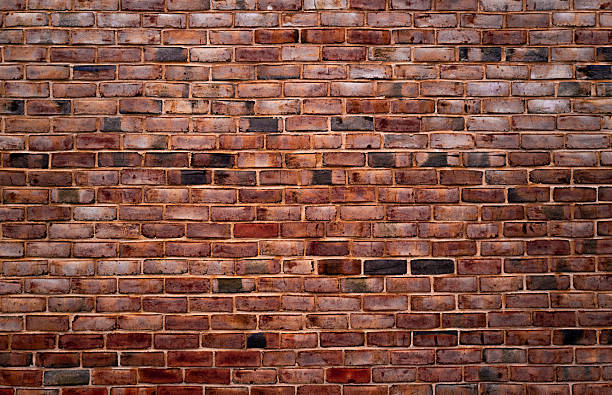 Brick brickwall, vintage texture. Red brick wall for construction themes. Brick wall background. Textured bricks for design projects. Solid bricks, wall structure close-up. Brick wall pattern.