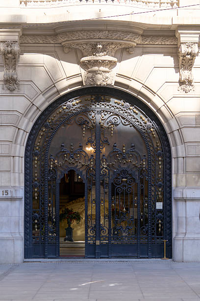istock Ornate wrought iron gate at elegant building entrance. 2244660270